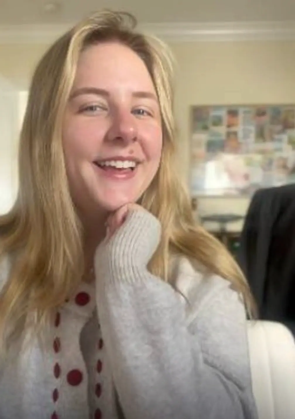 Socially Hygge founder smiling close-up in cozy cardigan